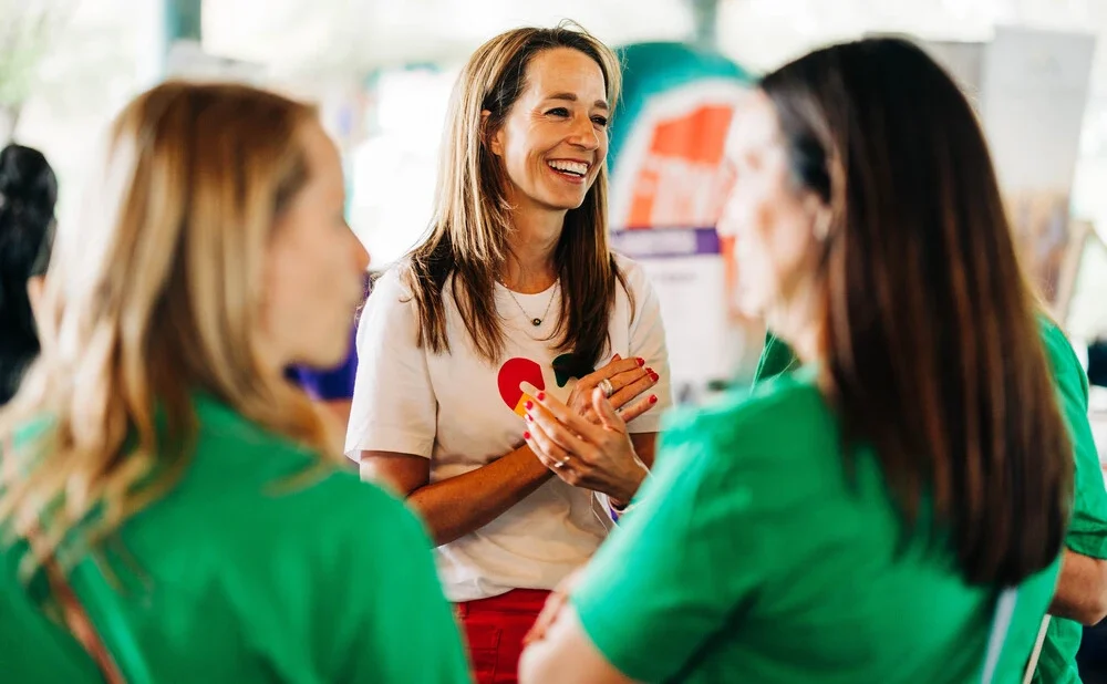 Abby Cox surrounded by volunteers